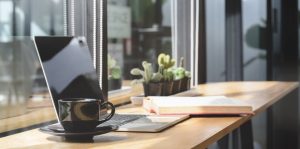 comfortable-co-working-space-with-laptop-computer-document-with-decorations_67155-3792